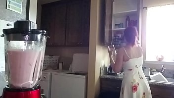 Making Summer drinks in a sexy dress
