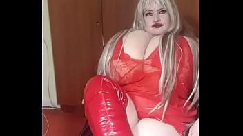 See this sexy Susi wearing red fishnet she is sitting on a chair showing her red boots