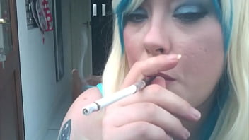 Chubby Blonde Smokes A Cigarette With A Holder