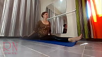 A girl without panties is doing yoga. Athlete exercising in a public yoga room. Spy camera.